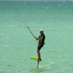 a man on a surf board in the water