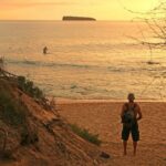 a man walking up a hill