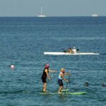 a group of people on a boat in a body of water